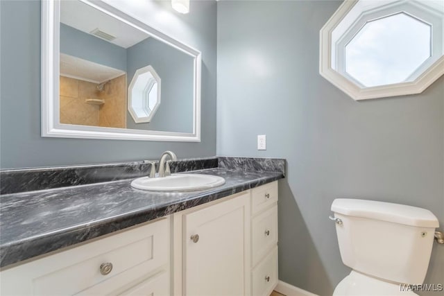 bathroom with vanity and toilet