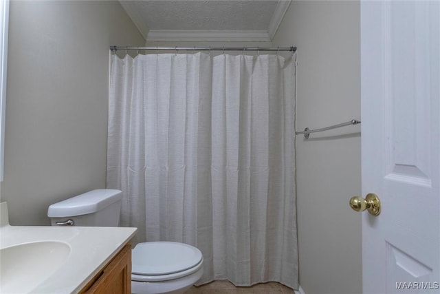 bathroom with vanity, toilet, crown molding, and a textured ceiling