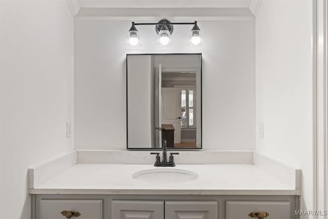 bathroom with crown molding and vanity