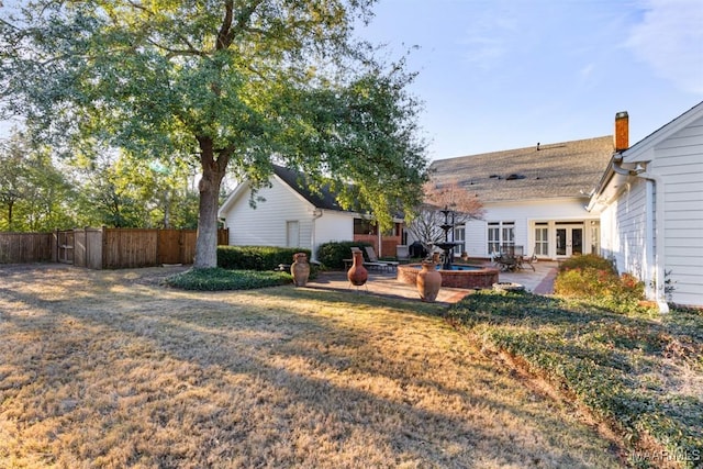 view of yard with a patio area and french doors