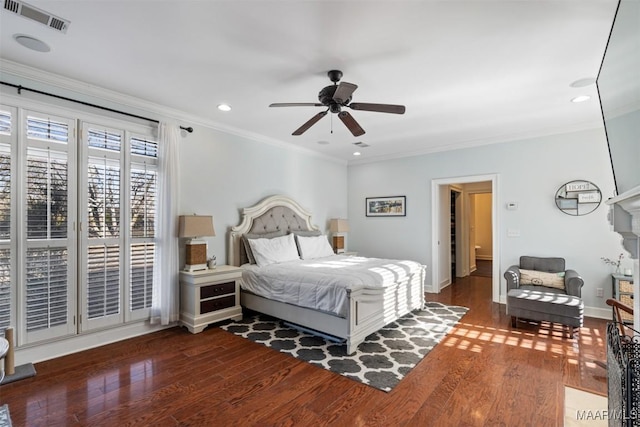 bedroom featuring ceiling fan, ornamental molding, and dark wood-type flooring