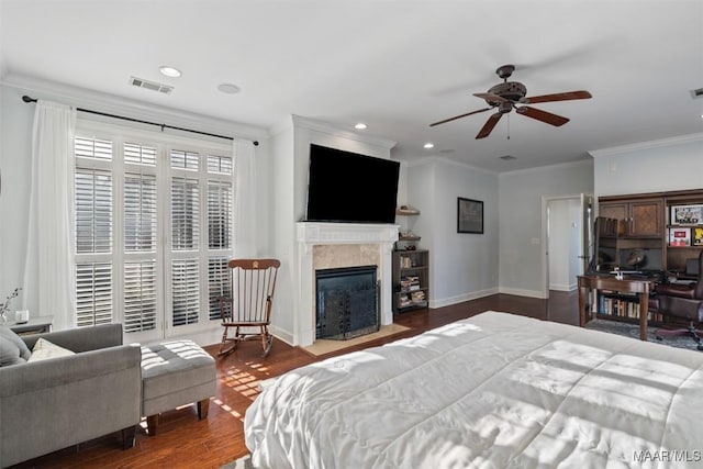 bedroom featuring ceiling fan, dark hardwood / wood-style flooring, and ornamental molding