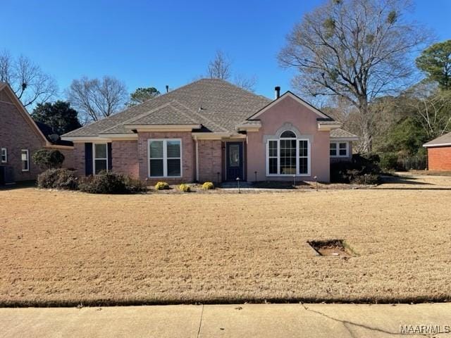 single story home featuring central AC