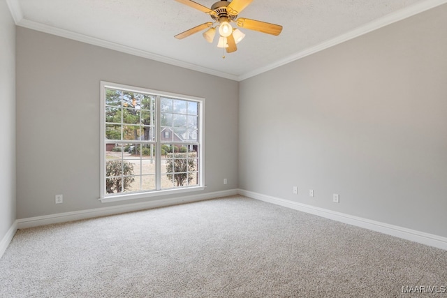 carpeted empty room featuring a textured ceiling, ceiling fan, and crown molding