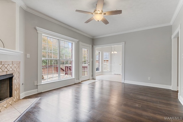 unfurnished living room featuring a fireplace, wood-type flooring, ceiling fan, and crown molding