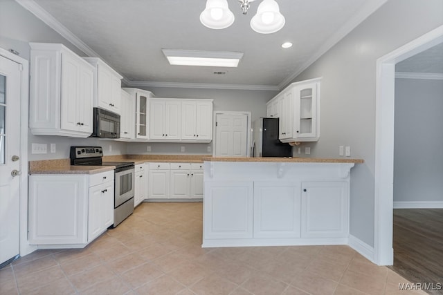 kitchen with white cabinets, light tile patterned floors, stainless steel appliances, and ornamental molding