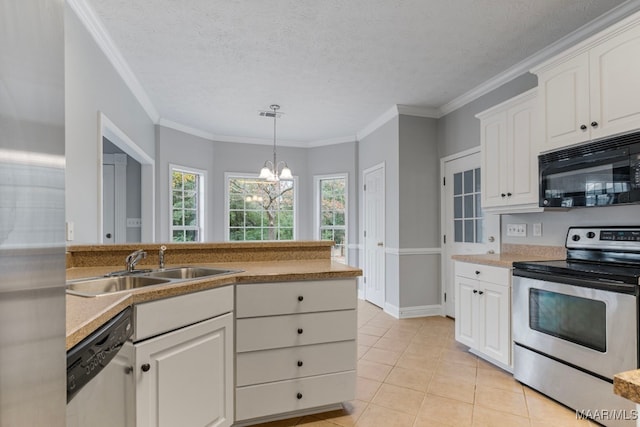 kitchen with a textured ceiling, a notable chandelier, white cabinetry, and stainless steel appliances