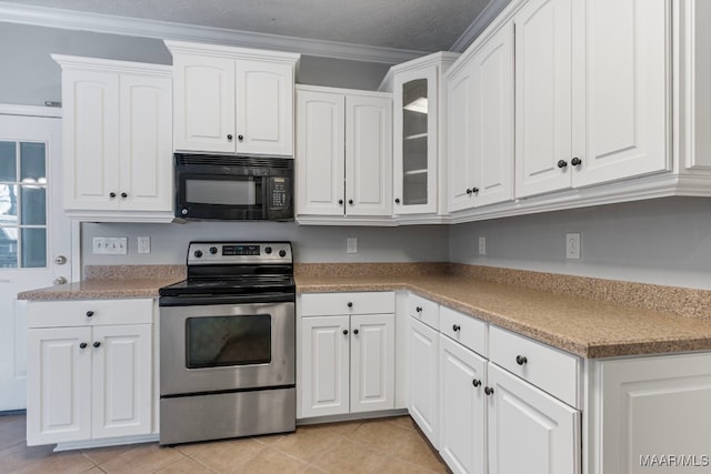 kitchen with white cabinets, crown molding, electric range, light tile patterned floors, and a textured ceiling