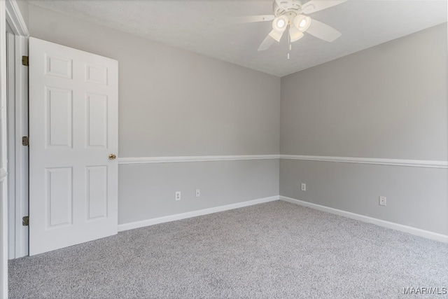 empty room with carpet and ceiling fan