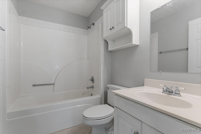 full bathroom featuring tile patterned flooring, shower / bathing tub combination, a textured ceiling, toilet, and vanity