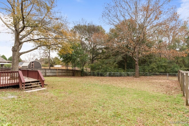 view of yard featuring a wooden deck