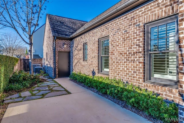 entrance to property featuring a patio area and central AC