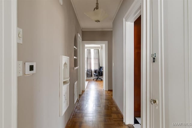 hallway featuring dark parquet floors and ornamental molding