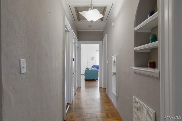 hallway with parquet floors and ornamental molding