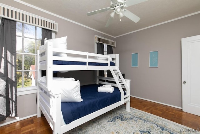 bedroom with ceiling fan, parquet flooring, and ornamental molding