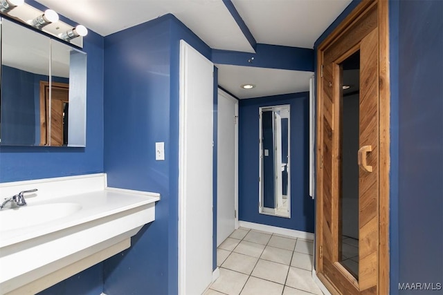 bathroom featuring sink and tile patterned flooring