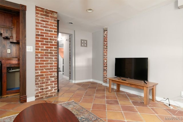 unfurnished living room featuring tile patterned flooring