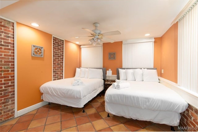 bedroom featuring tile patterned floors and ceiling fan