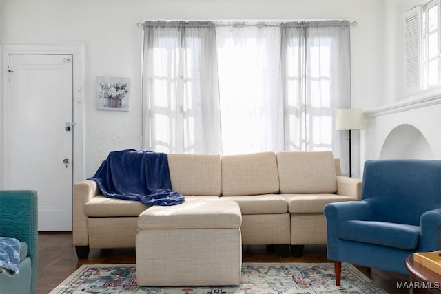 living room with parquet flooring