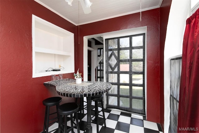 dining space featuring ornamental molding