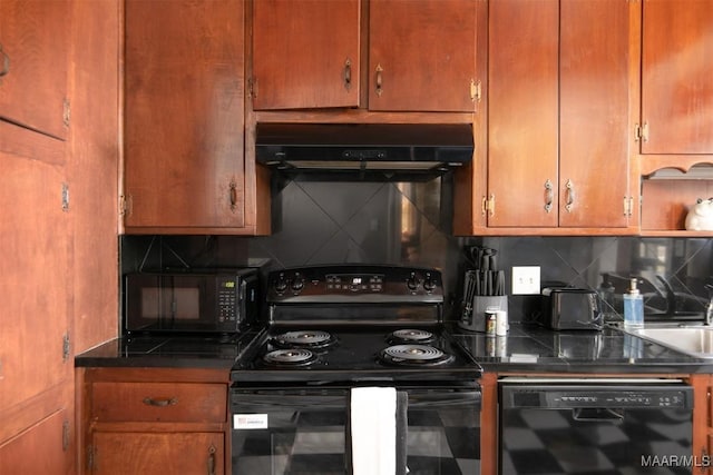 kitchen featuring black appliances, decorative backsplash, and sink