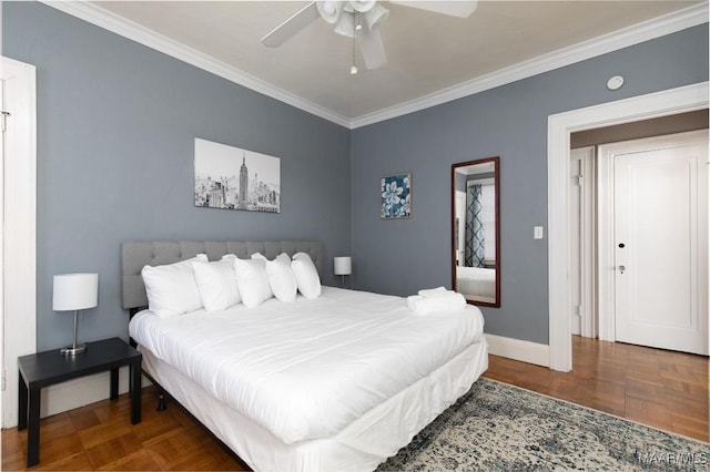 bedroom featuring dark parquet flooring, ceiling fan, and ornamental molding