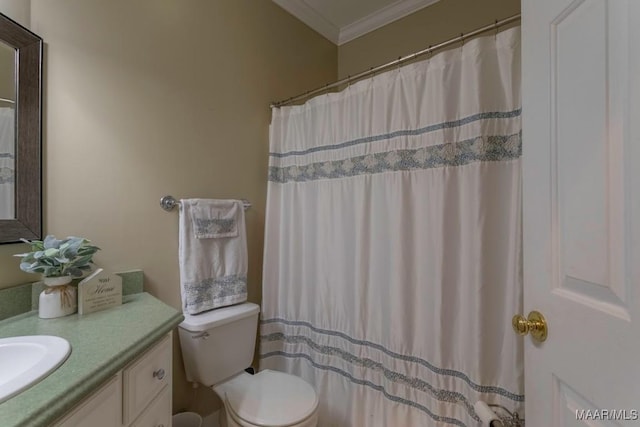 bathroom featuring toilet, vanity, and ornamental molding