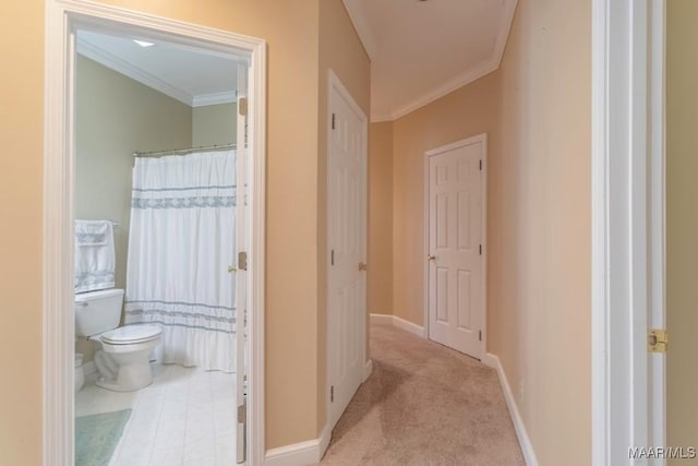 hall featuring crown molding and light colored carpet