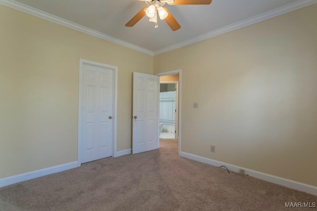 unfurnished bedroom with carpet, ceiling fan, and ornamental molding