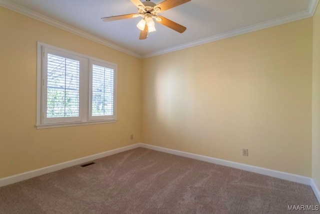 carpeted empty room with ceiling fan and crown molding