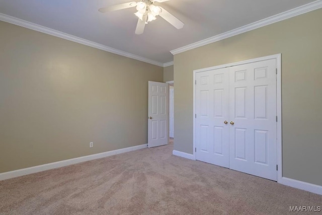 unfurnished bedroom with light carpet, a closet, ceiling fan, and ornamental molding