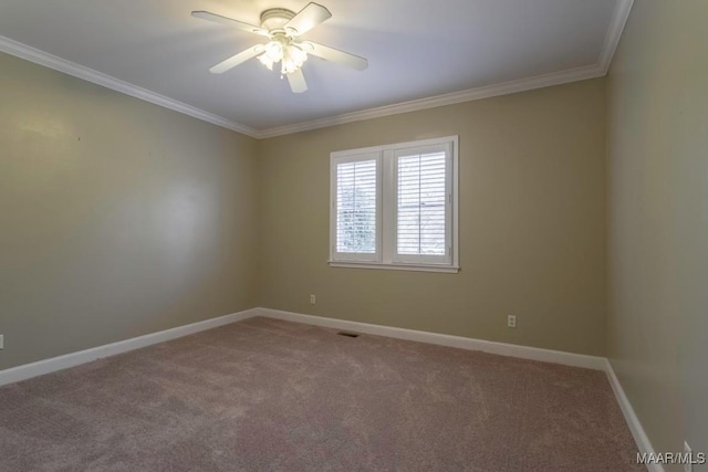 unfurnished room with ceiling fan, carpet floors, and crown molding