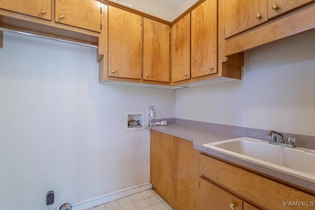 washroom featuring cabinets, sink, and hookup for a washing machine