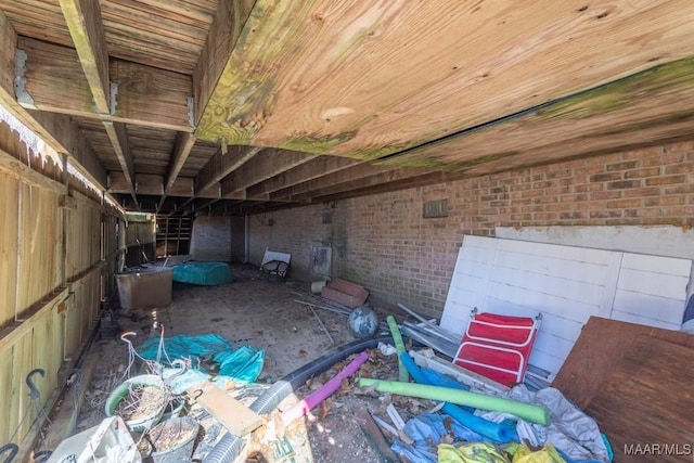 miscellaneous room featuring brick wall