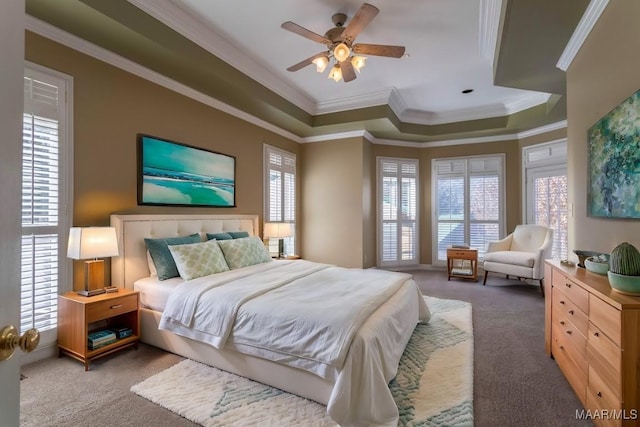 bedroom featuring dark carpet, ceiling fan, and ornamental molding