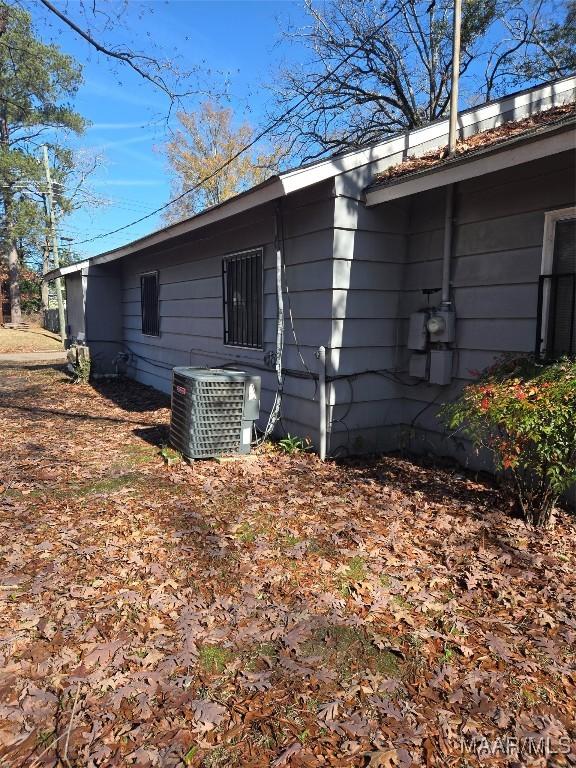 view of side of home with cooling unit