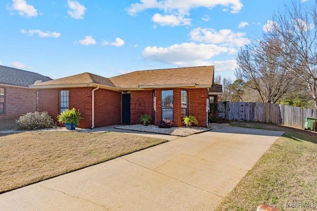 ranch-style house with a front lawn