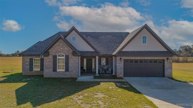 view of front of house featuring a front lawn and a garage