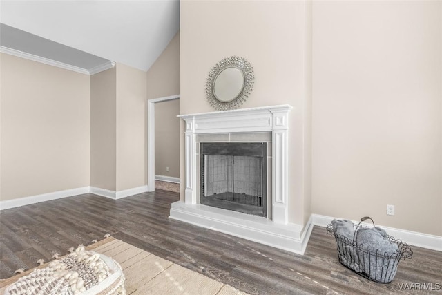 living room featuring dark hardwood / wood-style flooring, high vaulted ceiling, and ornamental molding