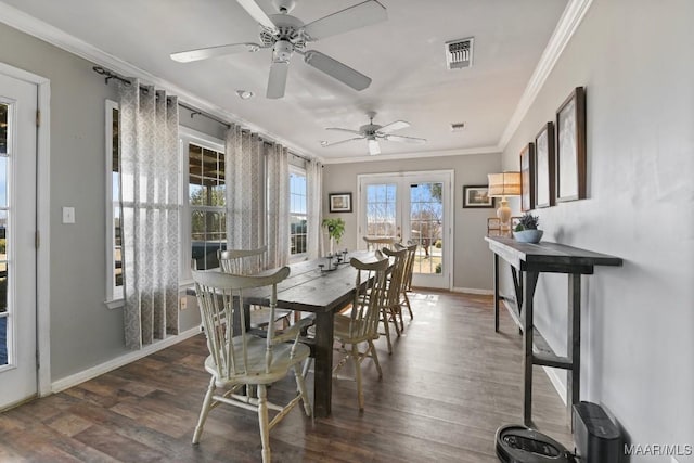 dining room featuring crown molding, dark hardwood / wood-style flooring, ceiling fan, and french doors