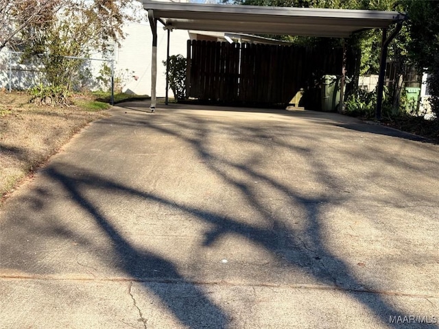 view of side of home featuring a carport