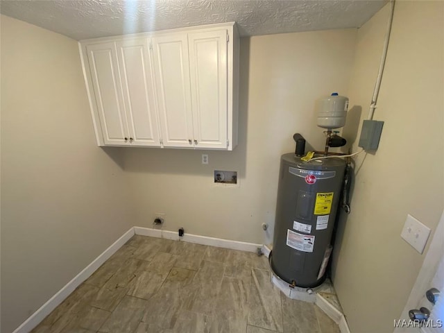 clothes washing area featuring washer hookup, cabinets, hookup for an electric dryer, electric water heater, and a textured ceiling