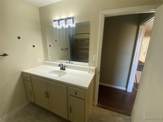 bathroom featuring a shower with shower curtain and vanity