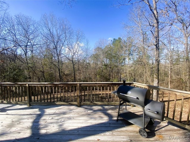 wooden terrace with area for grilling