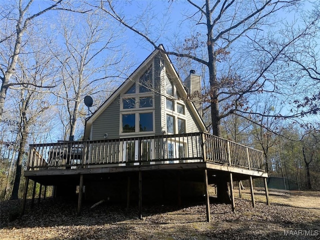 rear view of house with a wooden deck