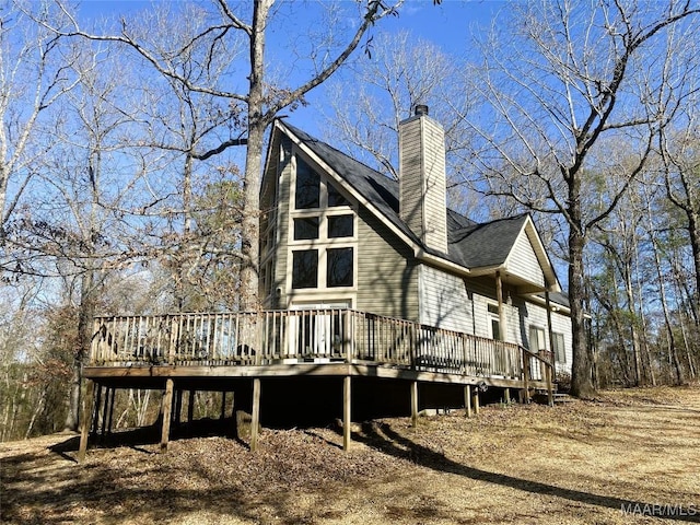 back of property with a deck