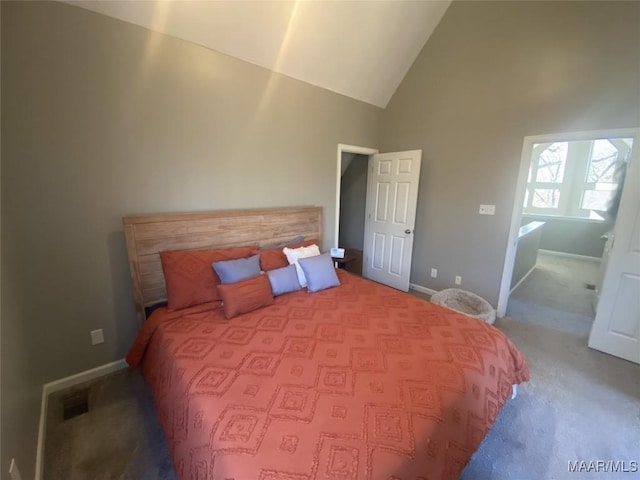 bedroom featuring carpet floors and high vaulted ceiling