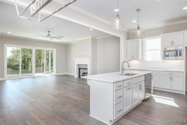 kitchen featuring white cabinetry, sink, and appliances with stainless steel finishes