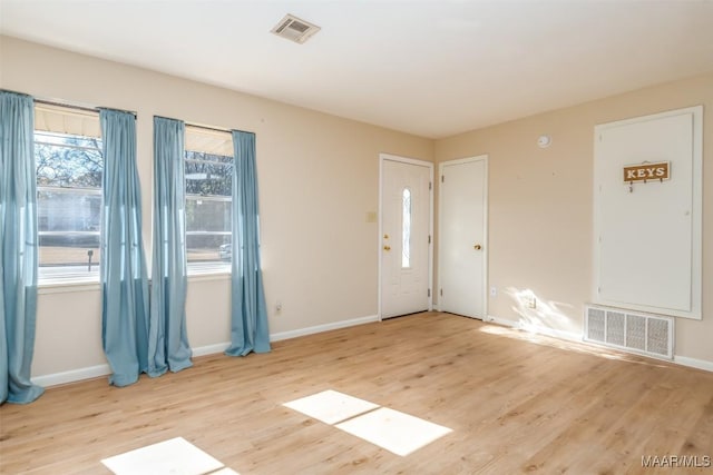 spare room with light hardwood / wood-style flooring