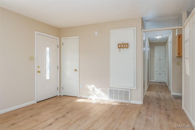 foyer with light hardwood / wood-style floors